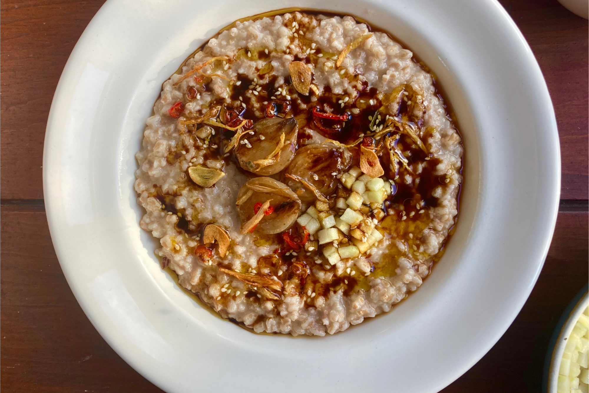 Spelt Congee with Miso Braised Shallots and Pickled Granny Smiths