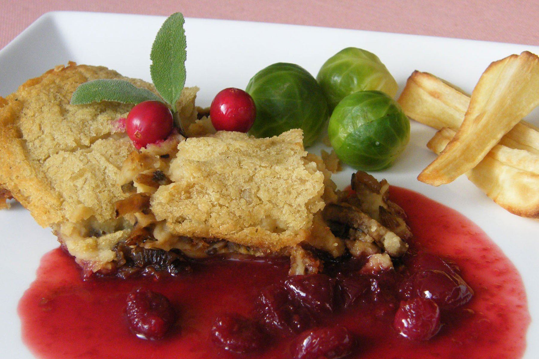 Sage and Onion Fava Bean Bake with Boozy Cranberry Sauce